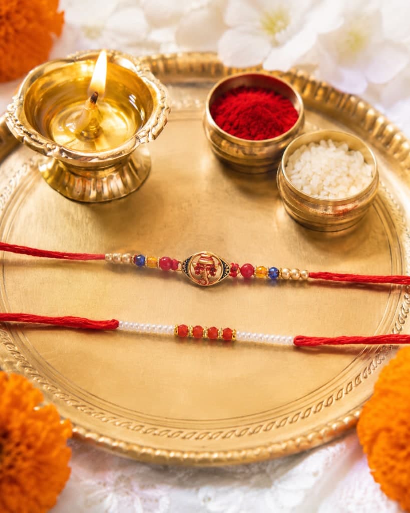 DivoRama Set of 2 Rakhis for Brother | Auspicious Ganpati Spiritual Rakhi & Red-White Beaded Rakhi | Designer Rakhi for Bhaiya Bhai | Raksha Bandhan 2026 Thread Rakhi